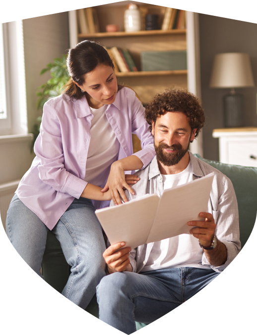 Couple looking over documents and options for Personal Insurance